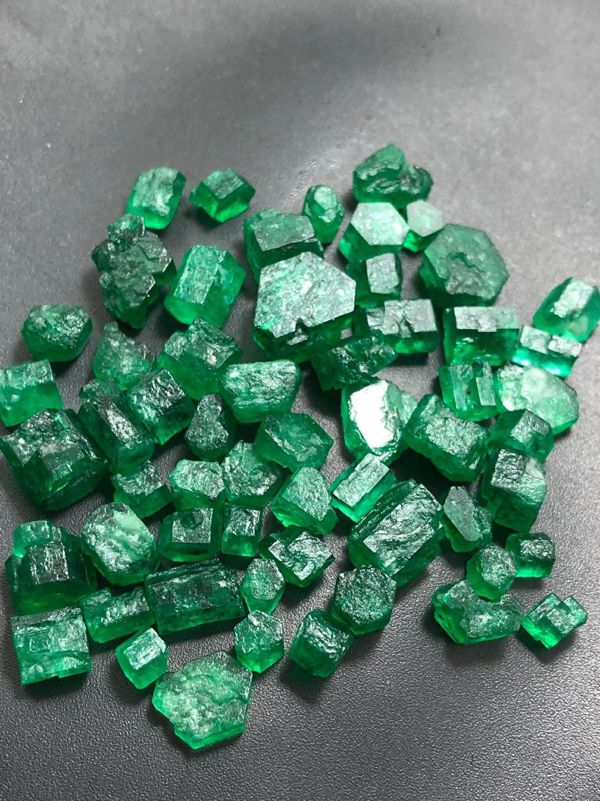 vivid green facet rough emerald
